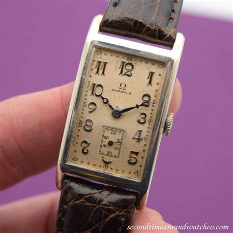 omega rectangular gold watch